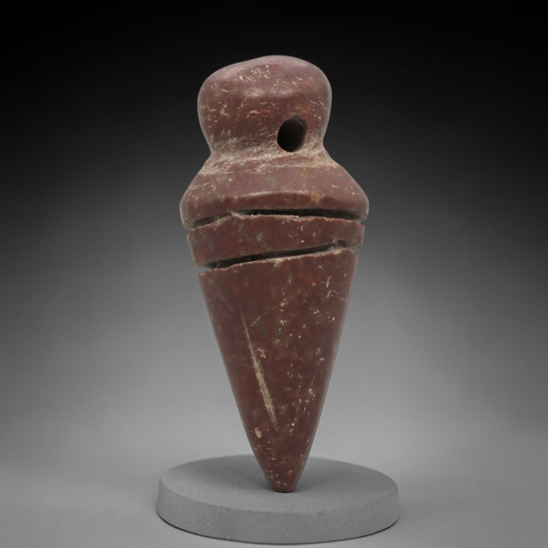 Ancient Near Eastern Red Stone Segmented Conical Amulet - Carved Pendant Figure, 36ZV: This amulet is carved from a rich, deep red stone with natural mineral speckling and patination, likely brecciated jasper or red steatite, featuring a robust segmented conical form. The piece consists