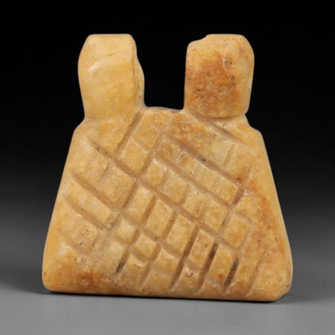 Ancient Egyptian Stone Amulet - Geometric Pattern Pendant, 83AE: Carved from stone, this ancient Egyptian amulet features a geometric grid pattern on its surface, a design typical of protective amulets from the Late Period. The form is compact with a suspension hol