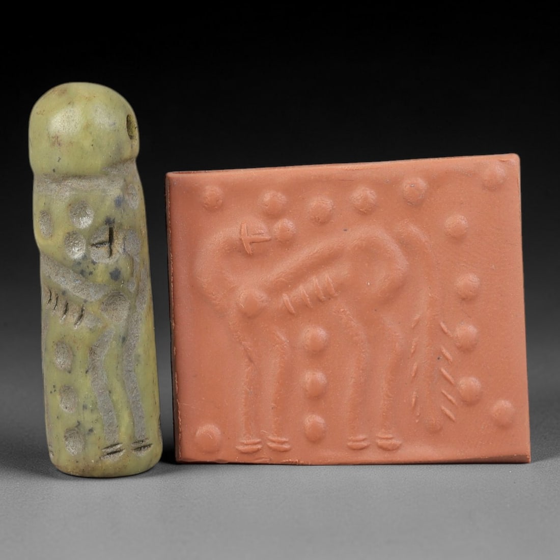 Ancient Serpentine Cylinder Seal - Mesopotamian Zoomorphic Motif, 63FX: Carved from serpentine, this cylinder seal exhibits the classic cylindrical form of ancient Mesopotamian ritual and administrative artifacts. Its surface is intricately carved with a prominent zoomorp