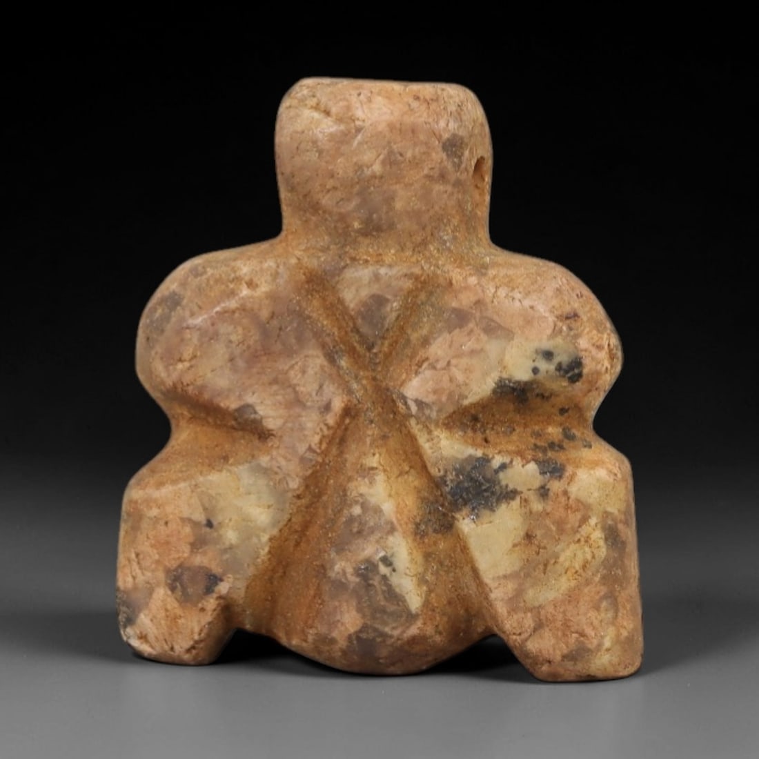 Ancient Egyptian Stone Idol Amulet - Carved Ritual Figurine, 86AE: Carved from mottled beige stone, this small idol features a humanoid form with incised linear detailing, consistent with ancient Egyptian ritual idols of the Late Period. The piece has a suspension ho