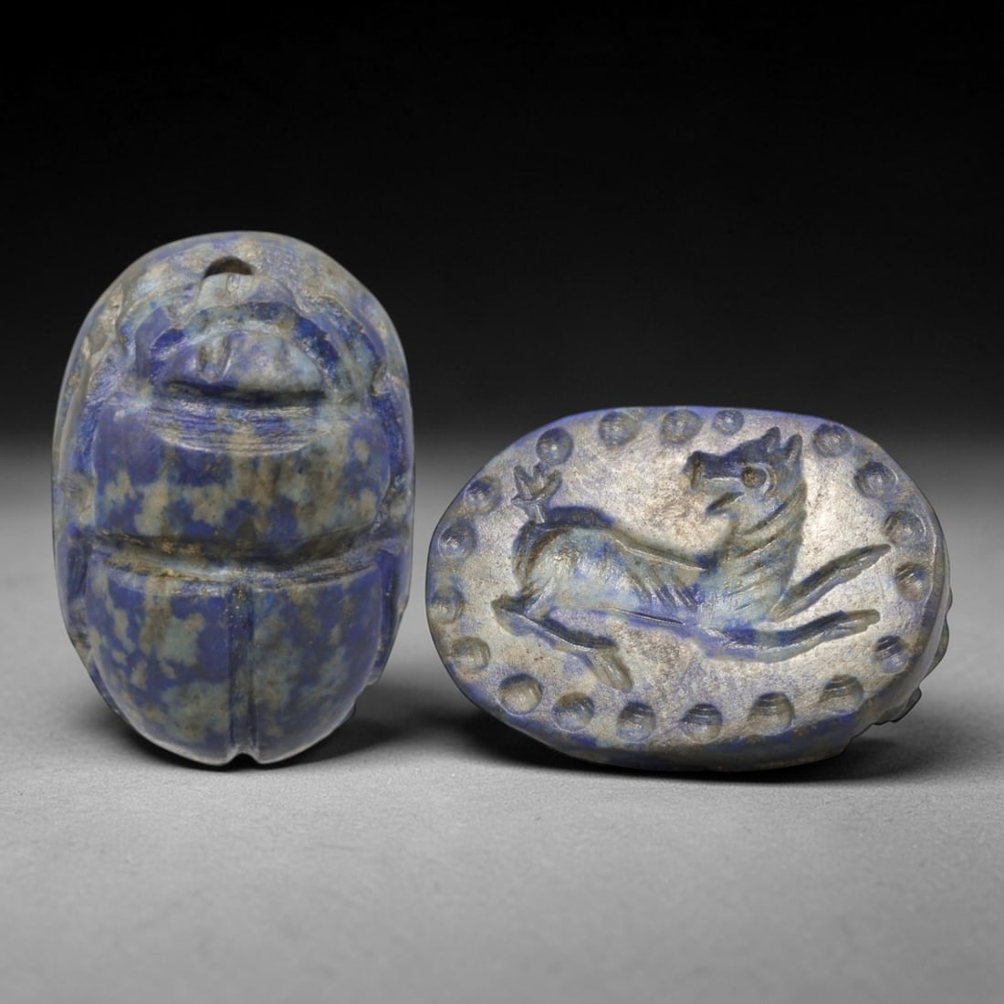 Ancient Lapis Lazuli Scarab - Near Eastern Zoomorphic Seal, 61AS: This artifact is hand-carved from lapis lazuli, employing traditional ancient lapidary techniques consistent with Near Eastern Bronze Age seal craftsmanship. The object takes the form of a scarab beet