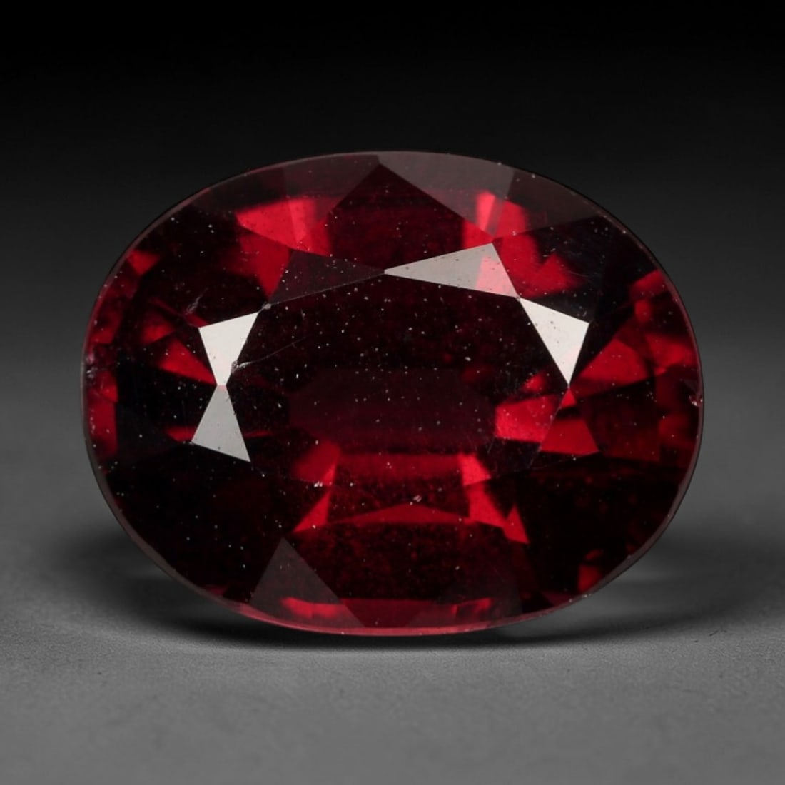 2.881 Carats Certified Orangy Red Pyrope-Almandine Garnet - Natural Gemstone, LZ272: This impressive 2.881 carat oval mixed-cut garnet delivers a saturated, fiery orangy-red hue reminiscent of glowing embers and sunset horizons. The mixed faceting is expertly executed to amplify the s