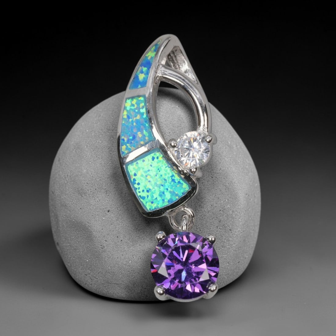 3.96g 925 Sterling Silver Drop Pendant - Simulated Opal Amethyst, 47D: Crafted from stamped 925 sterling silver, this pendant features a curved openwork upper section with three rectangular segments of simulated opal inlay, exhibiting vivid iridescent green and blue play