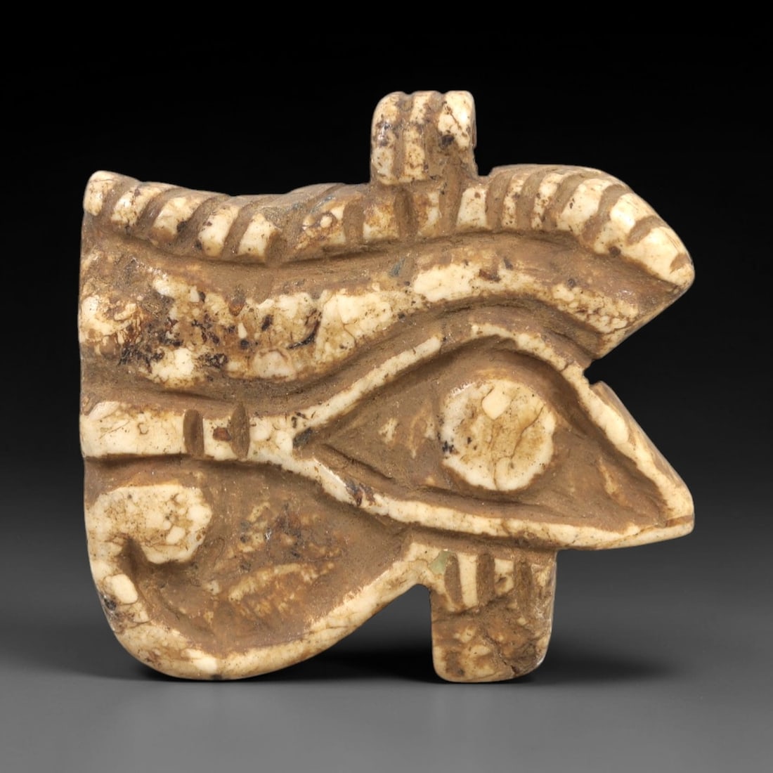 Ancient Egyptian Wedjat Eye Amulet - Stone Protective Talisman, 99AL: This amulet is carved from creamy-white stone with natural veining and a weathered patina, depicting the iconic **Wedjat Eye (Eye of Horus)**-a central symbol of ancient Egyptian religion. The piece f