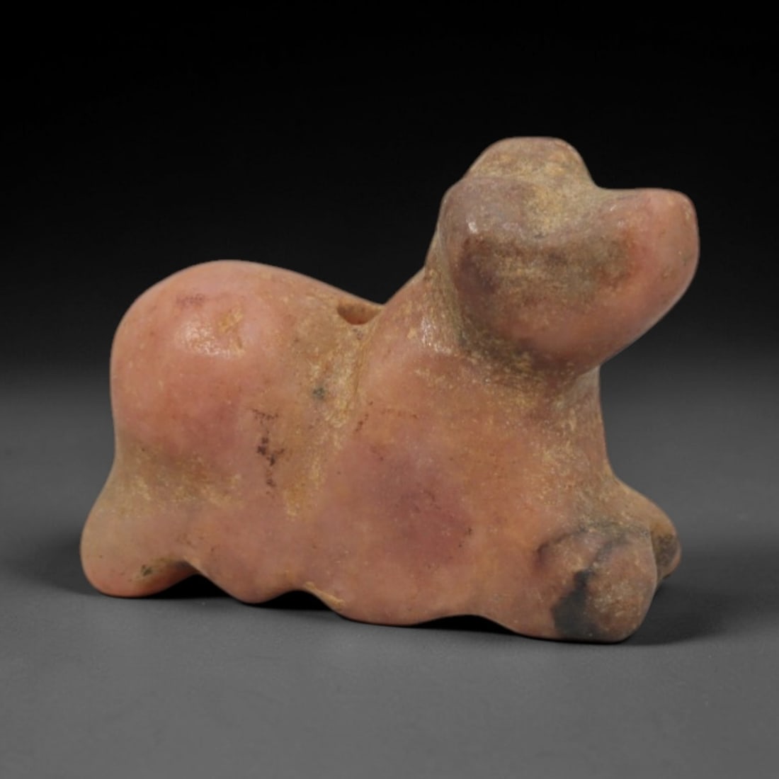 Ancient Pink Stone Zoomorphic - Indus Valley Miniature Amulet, 72XP: Carved from soft, pale pink stone, this miniature zoomorphic amulet depicts a stylized quadrupedal creature, likely a domesticated animal such as a calf or lamb, a recurring motif in Indus Valley port