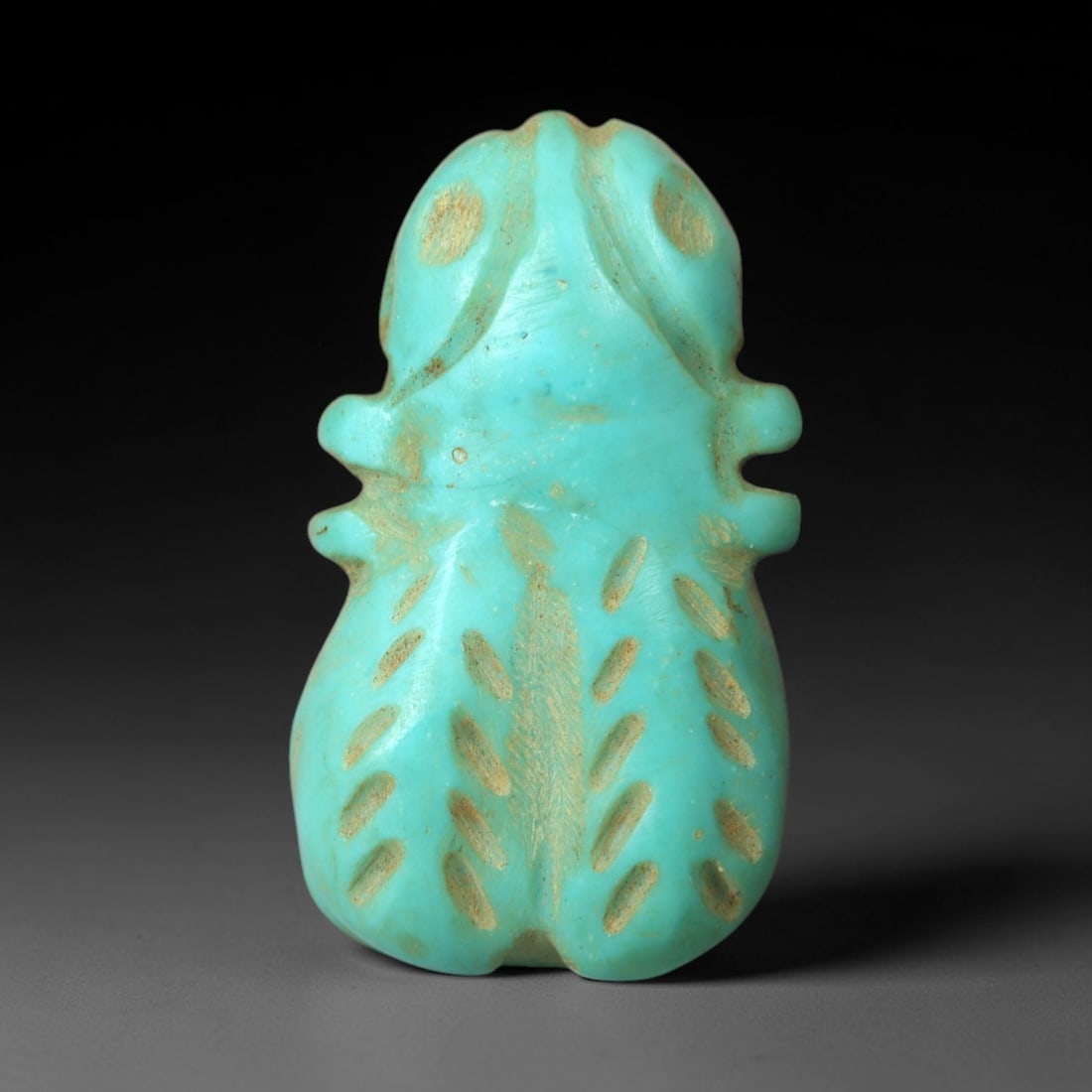 Ancient Turquoise Fly Amulet - Egyptian Ritual Pendant, 48AN: Carved from turquoise, this amulet is formed in the shape of a fly, with large stylized eyes, segmented wing details, and a compact body. The vibrant turquoise stone exhibits characteristic veining an