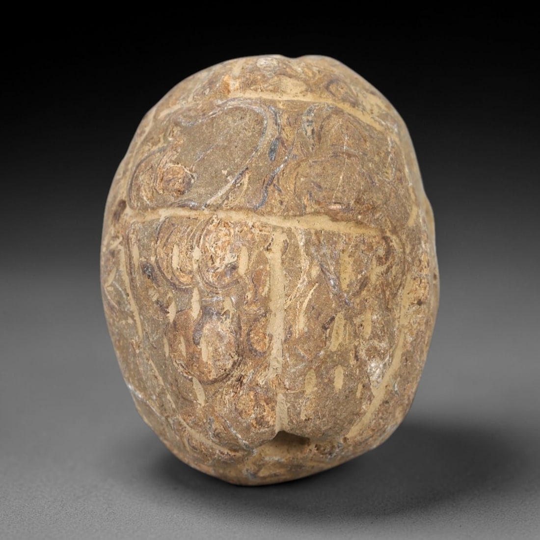 Ancient Egyptian Stone Scarab - Amulet Figurine, 8AM: This artifact is a carved stone scarab amulet, crafted from a granular, tan-brown stone with a weathered, textured surface and natural earthy patina. The dorsal side features segmented elytra with inc