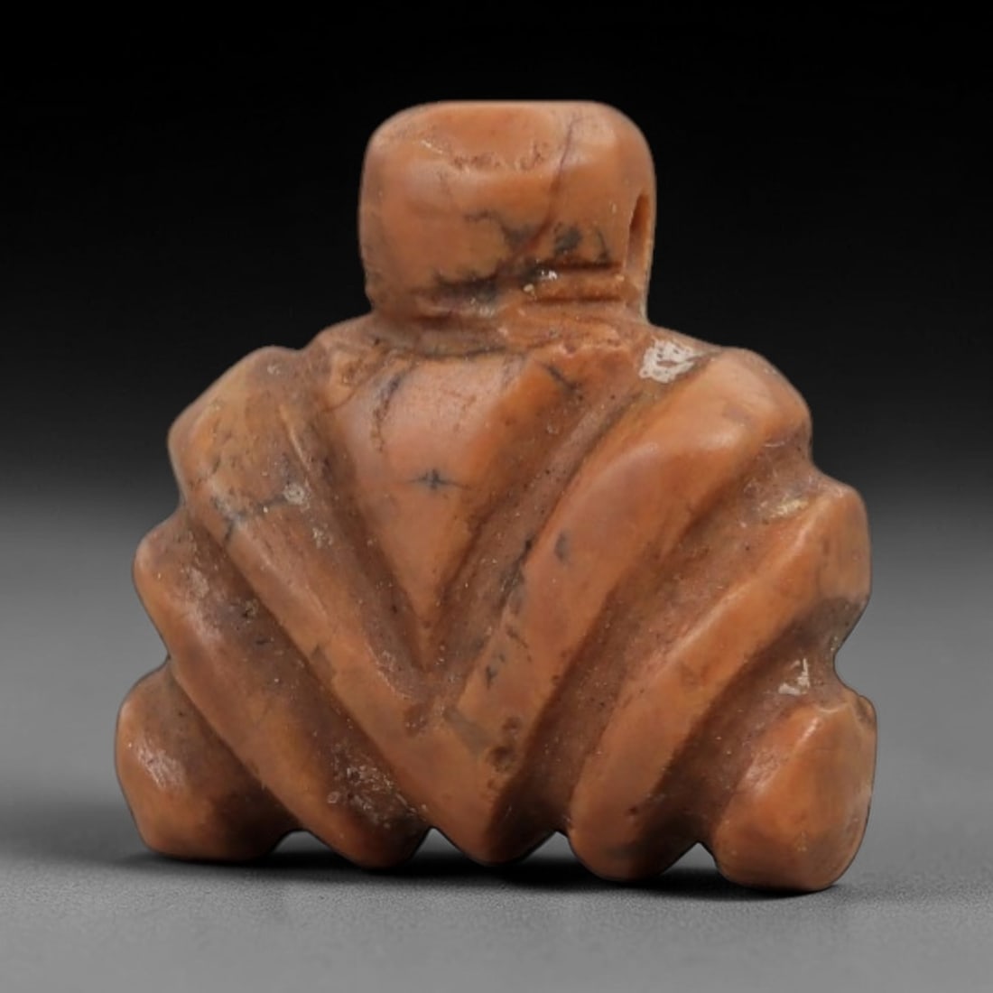 Ancient Egyptian Stone Amulet - Fly-Shaped Relic, 10AG: Carved from fine-grained stone, this small amulet features a stylized fly form with incised detailing on the body and wings, a motif common in ancient Egyptian protective amulets. The piece exhibits a