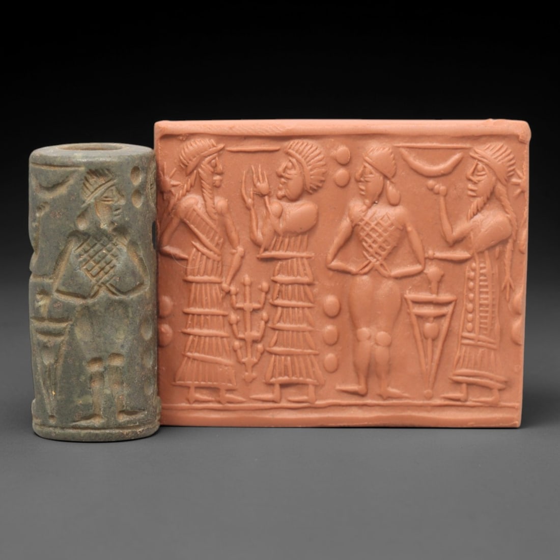 Ancient Steatite Cylinder Seal - Mesopotamian Ritual Assembly Scene, 12ZP: Carved from muted green steatite, this ancient Mesopotamian cylinder seal depicts a formal ritual assembly scene, executed with precise glyptic craftsmanship characteristic of the Late Bronze Age. The
