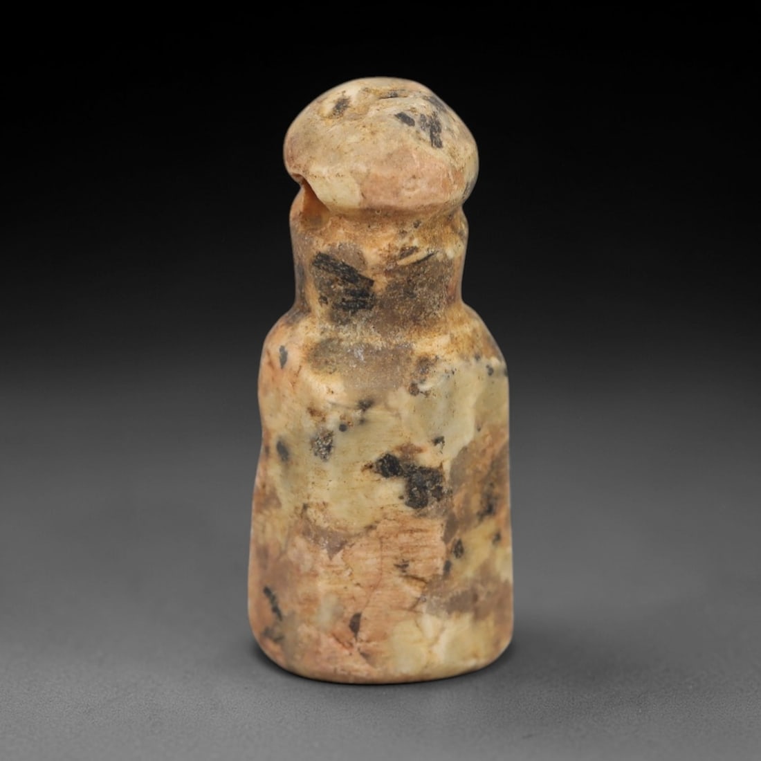 Ancient Grey Stone Pendant - Egyptian Style Figurine, 38AG: Carved from grey stone, this ancient Egyptian-style pendant features a compact, rounded form with a suspension hole at the top, indicating its use as a wearable amulet. The carving exhibits primitive