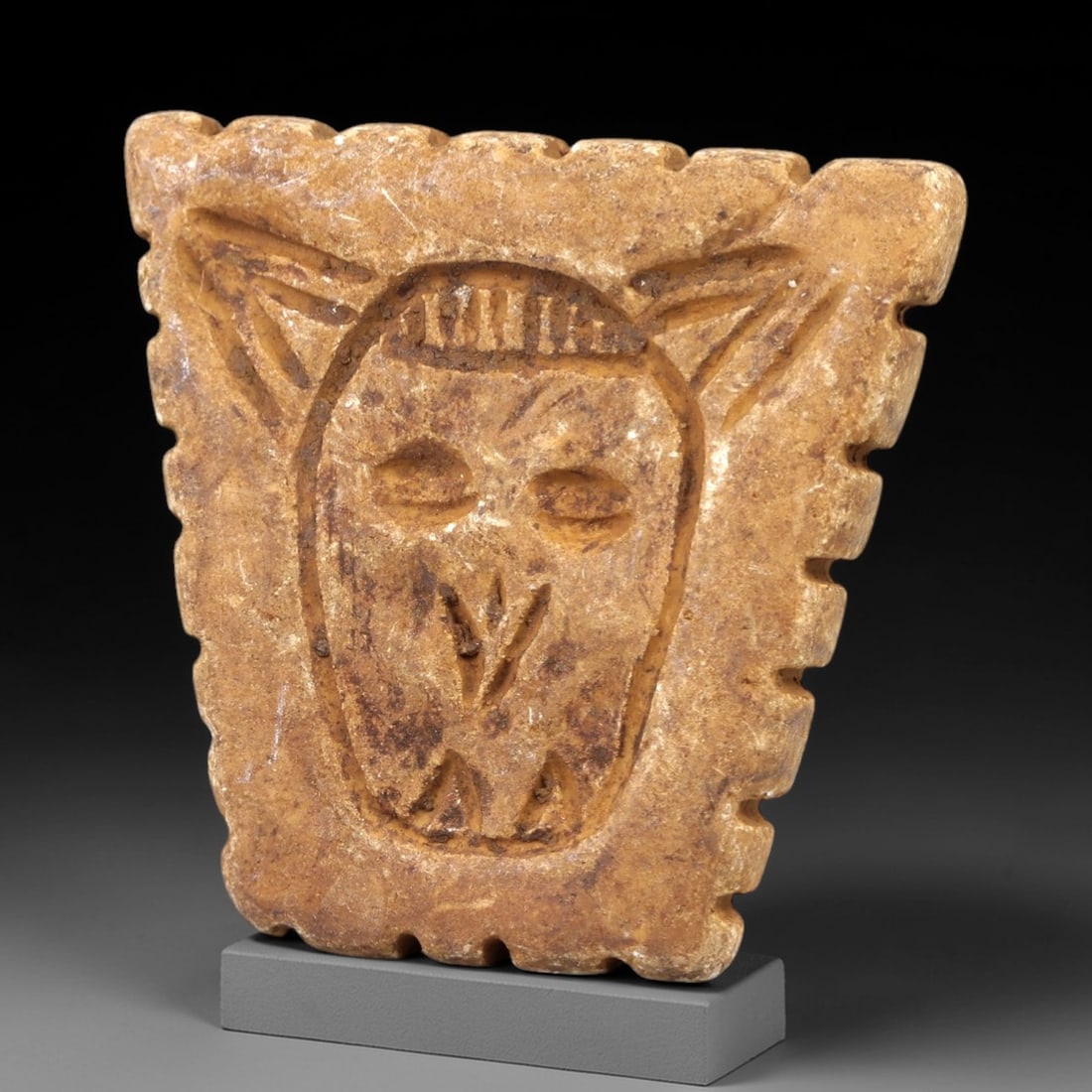 Ancient Stone Stamp Seal - Near Eastern Figurine, 78AL: Carved from tan speckled stone, this stamp seal consists of two distinct components: a rectangular base with incised linear edge detailing and a raised animal-headed finial, likely a bovine or caprid,