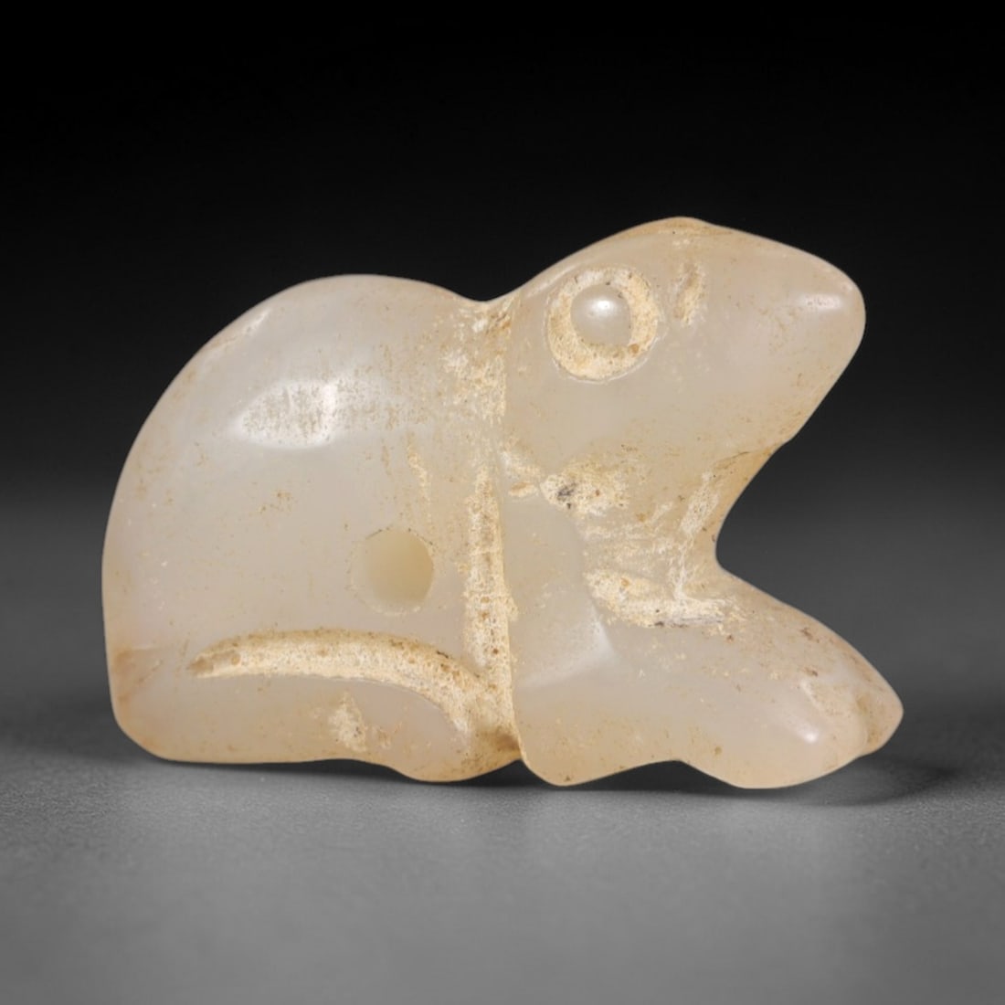 Ancient Chalcedony Rodent Amulet - Egyptian Figurine, 86AR: This artifact is carved from translucent, pale chalcedony, exhibiting a smooth, polished surface with subtle natural inclusions and faint surface wear consistent with age. The form is a stylized roden