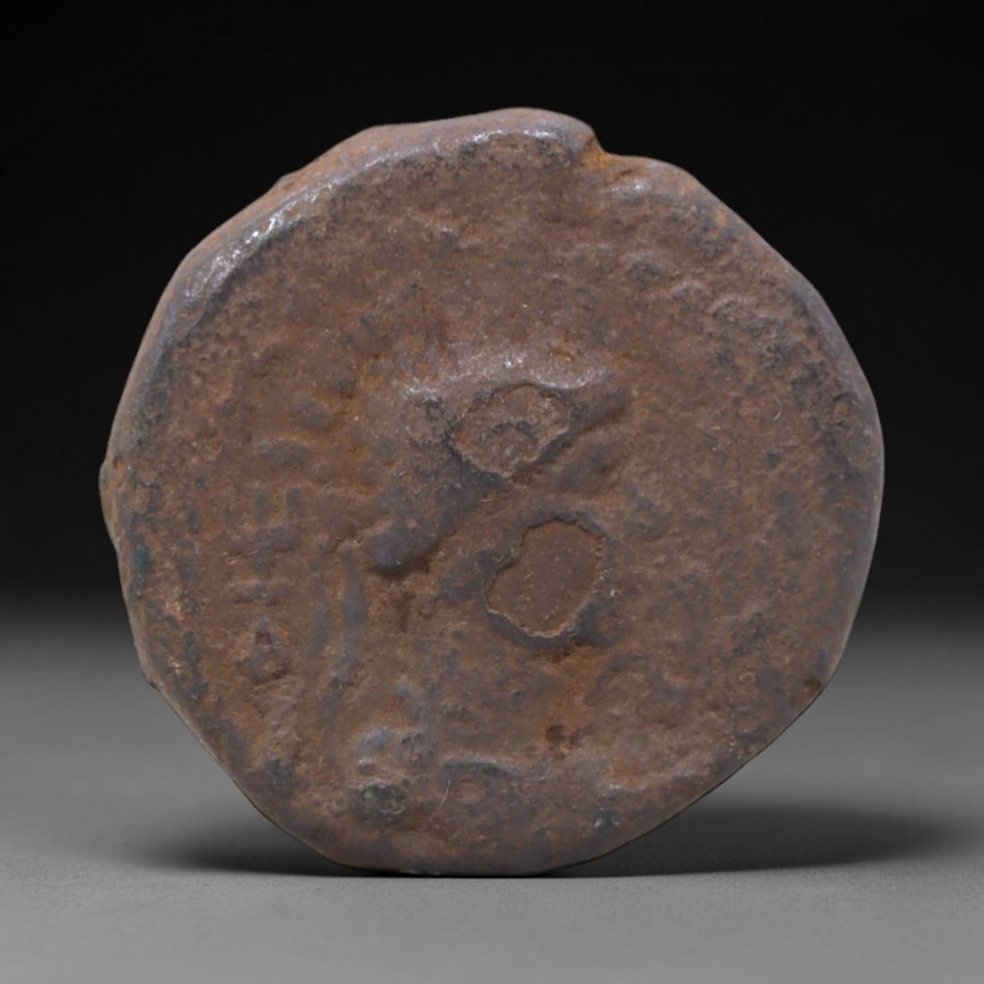 INDO-GREEK KINGDOM: Hellenistic Symbolism Bronze Coin, 2nd-1st Century BCE, 20mm, 9g, 25XS: This robust bronze coin from the Indo-Greek realms is a tangible link to the fusion of Hellenistic and South Asian cultures that defined the ancient crossroads of Central Asia. The obverse bears a sty