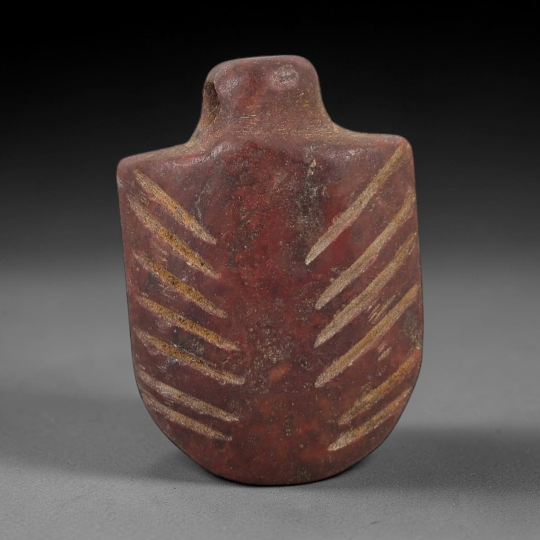 Ancient Egyptian Stone Amulet - Parallel Line Carved Pendant, 71AE: Carved from stone, this ancient Egyptian amulet features parallel linear patterns on its surface, a common decorative technique in Egyptian amuletic art from the Late Period. The compact pendant has a