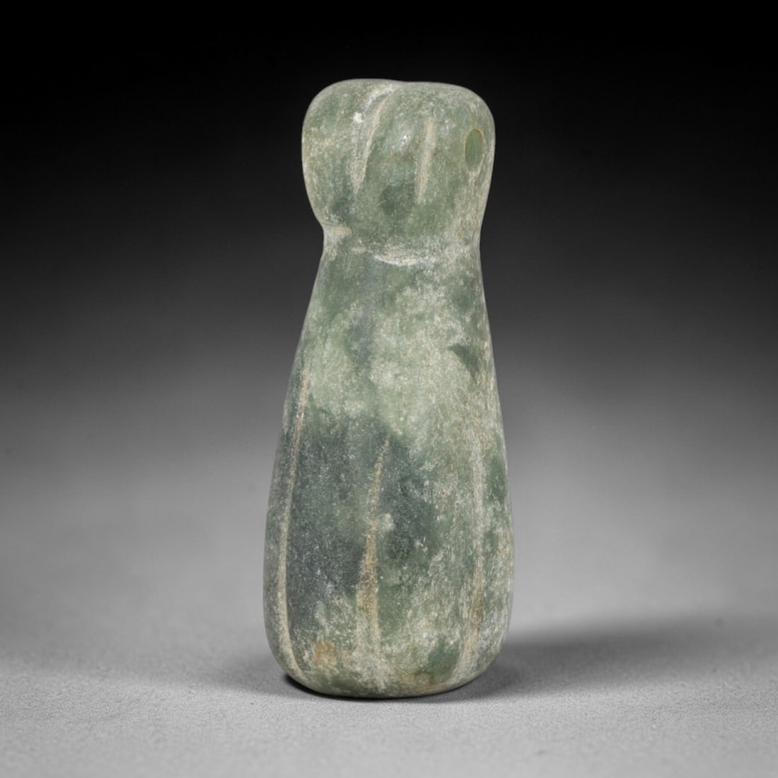 Ancient Serpentine Melon/Bead Amulet - Near Eastern Ritual Pendant, 37AR: Carved from variegated green serpentine, this amulet features a swollen, pear-shaped form with subtle vertical fluting evoking a melon or gourd motif, topped by a segmented collar and pierced suspensi