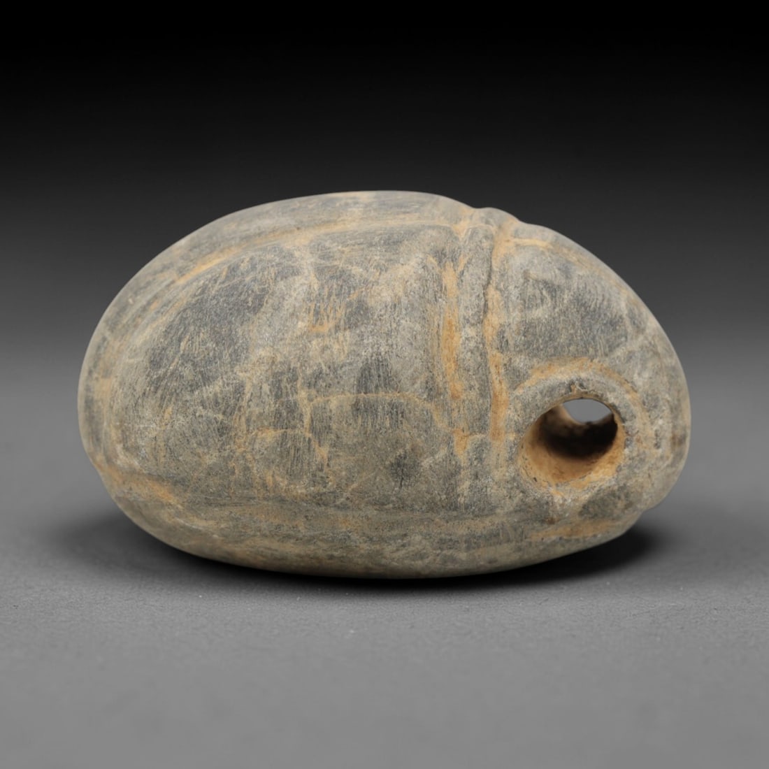 Ancient Steatite Scarab Amulet - Near Eastern Figurine, 64ZQ: Carved from steatite, this scarab amulet features a naturalistic form with incised detailing for facial features and wing texture. The stone has a warm, earthy patina with minor surface wear consisten