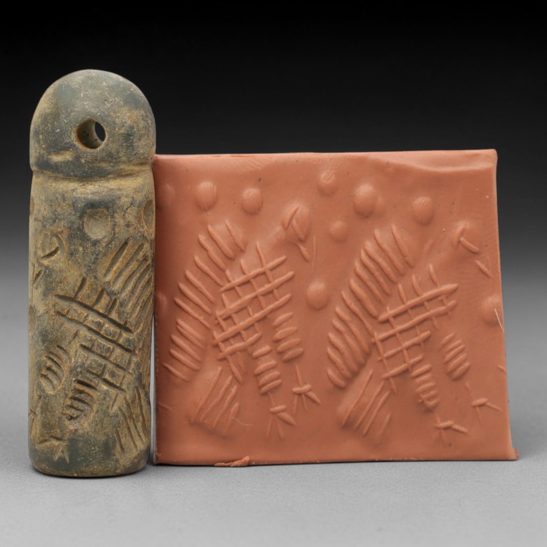Ancient Serpentine Cylinder Seal - Mesopotamian, 52ZT: Carved from serpentine, this cylinder seal follows the classic cylindrical form of ancient Mesopotamian administrative and ritual artifacts. Attributed to the Bronze Age Mesopotamian cultures, this se