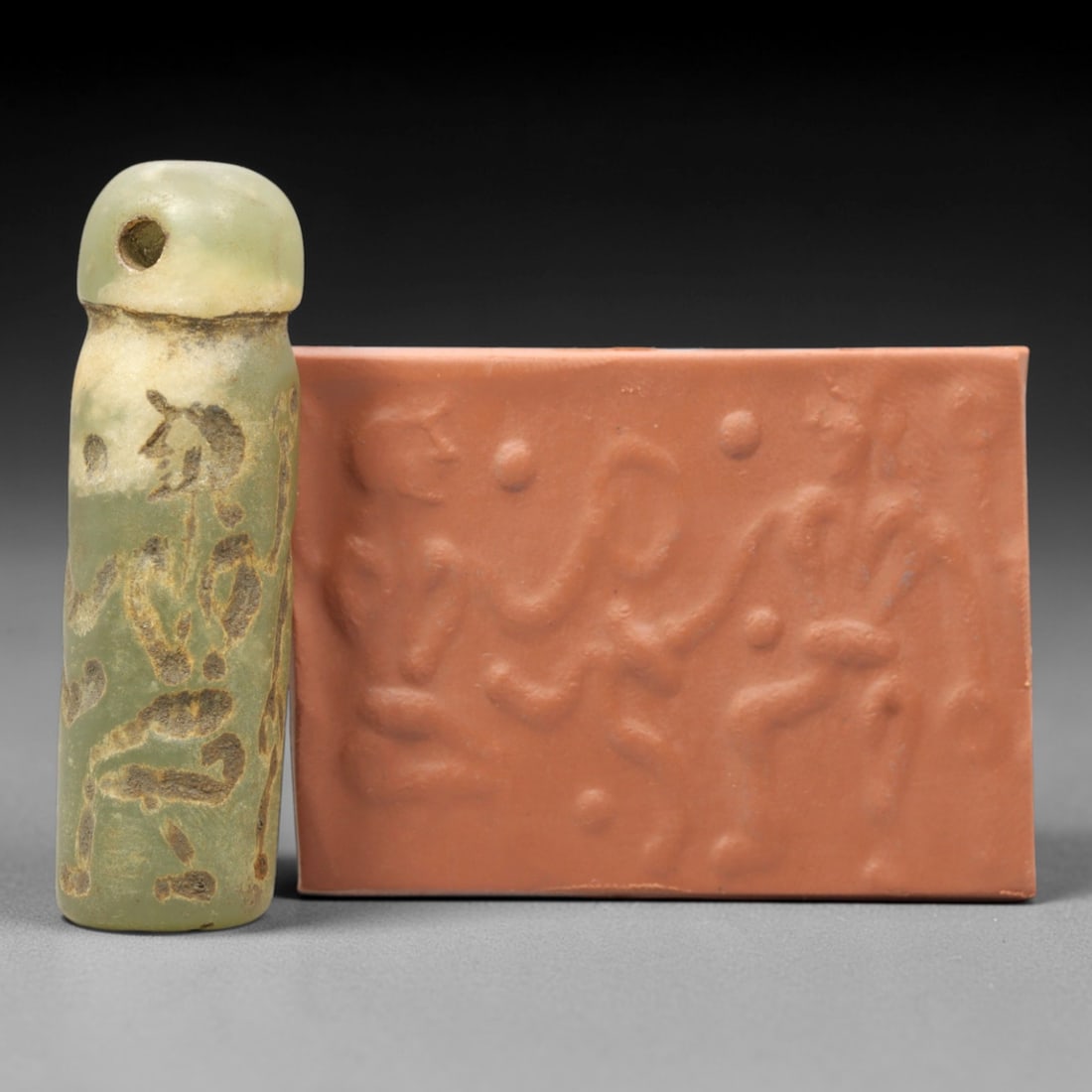 Ancient Serpentine Cylinder Seal - Mesopotamian, 42ZT: Carved from serpentine, this cylinder seal follows the classic cylindrical form of ancient Mesopotamian administrative and ritual artifacts. Attributed to the Bronze Age Mesopotamian cultures, this se