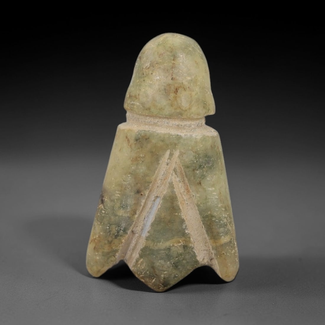 Ancient Stone Lotus Amulet - Egyptian Ritual Figurine, 41AG: This amulet is carved from a single piece of pale greenish stone, exhibiting a granular texture with subtle mottling and earthy inclusions across its surface. The form is stylized as a lotus bud, with