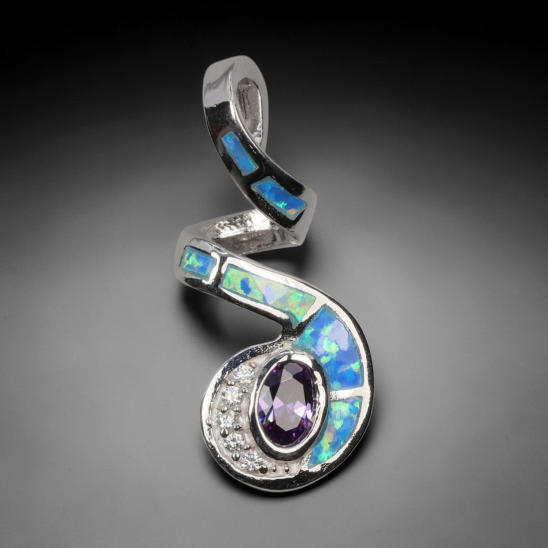 3.97g 925 Sterling Silver Spiral Pendant - Simulated Opal Amethyst, 1D: Crafted from stamped 925 sterling silver, this pendant features a dynamic spiral openwork design. Four rectangular segments of simulated opal are inlaid along the curved silver bands, exhibiting vivid