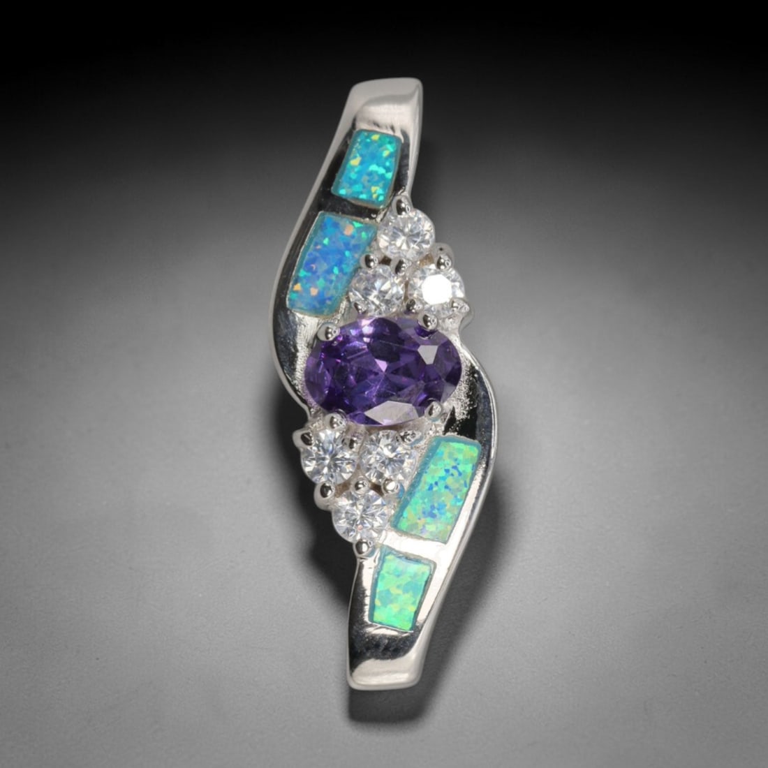 4.48g 925 Sterling Silver Swirl Pendant - Simulated Opal Amethyst, 27D: Crafted from stamped 925 sterling silver, this pendant features a dynamic swirling openwork design. Four rectangular segments of simulated opal are inlaid along the curved silver edges, exhibiting viv