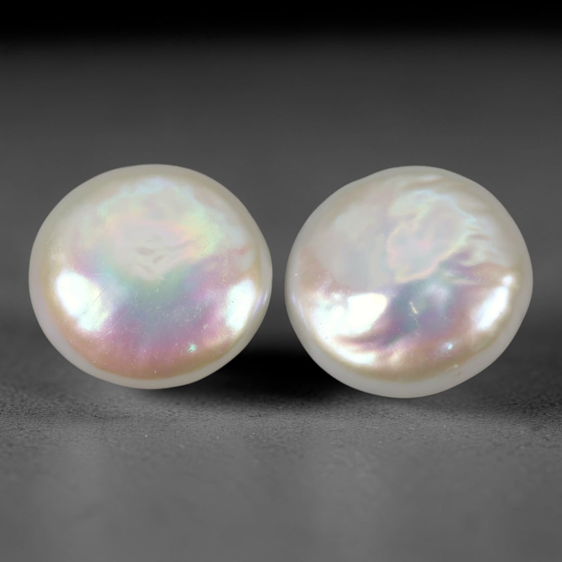 9.51 Carats Button Pearl - Natural Loose Gemstone 11.7 x 11.6mm, 25XP: This striking pair of button pearls features a harmonious white base with iridescent pinkish and bluish overtones, showcasing the classic luster that defines premium natural pearls. Measuring 11.7 x 1