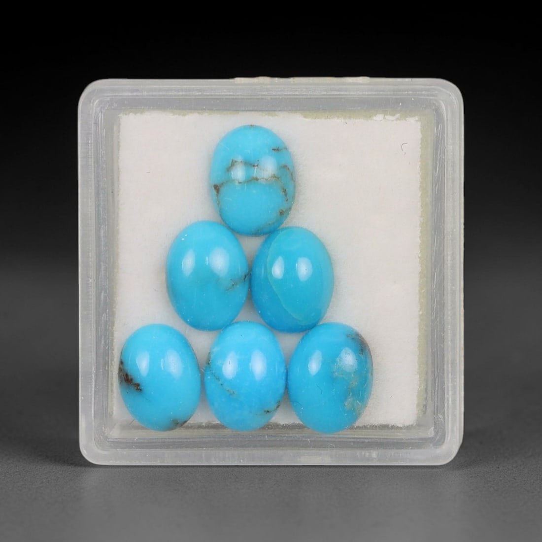 6.29 Carats Natural Sleeping Beauty Turquoise Oval Cabochon Parcel - Natural Arizona Stones, 52XP: This curated parcel of six oval cabochon Sleeping Beauty turquoise gems showcases a vivid, uniform sky-blue hue, with subtle natural matrix veining that highlights their authentic, unaltered origin. T