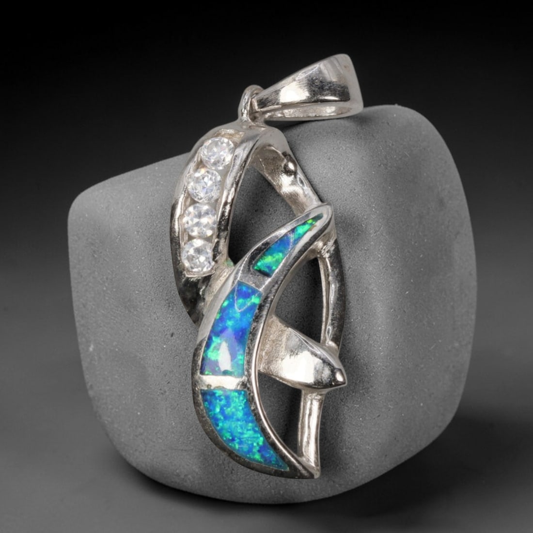 4.3g 925 Sterling Silver Leaf Pendant - Simulated Opal, 20D: Crafted from stamped 925 sterling silver, this pendant features an elegant dual-leaf openwork design with polished detailing. Three rectangular segments of simulated opal are inlaid along the lower le