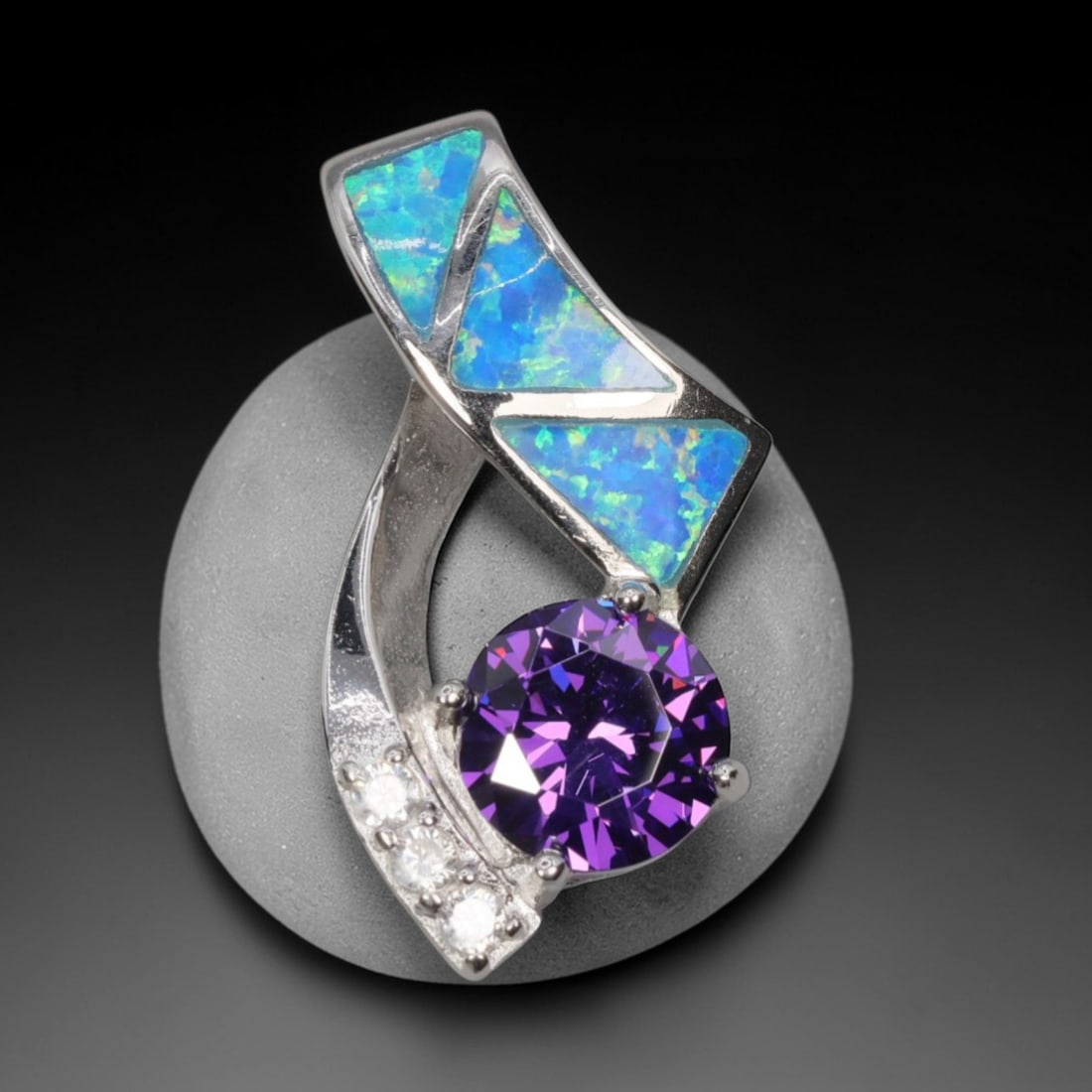 4.04g 925 Sterling Silver Swirl Pendant - Simulated Opal Amethyst, 5D: Crafted from stamped 925 sterling silver, this pendant features a dynamic swirling openwork design. Three triangular segments of simulated opal are inlaid along the upper curved silver band, exhibitin