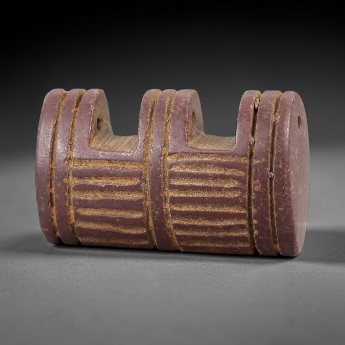 Ancient Jasper Amulet - Architectural Form Relic, 7AM: This amulet is carved from a deep reddish-purple jasper, exhibiting a dense, fine-grained texture with natural ochre patina in the incised grooves. The form is a stylized architectural motif, featurin