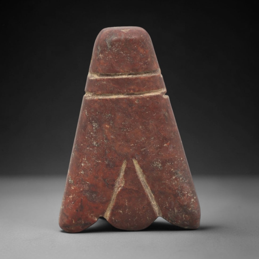 Ancient Egyptian Red Stone Tyet (Isis Knot) Amulet - Carved Pendant Figure, 28ZV: This amulet is carved from a rich, deep red stone with natural mineral speckling and patination, likely brecciated jasper or red steatite, featuring the iconic tyet (Isis knot) form. The piece consist