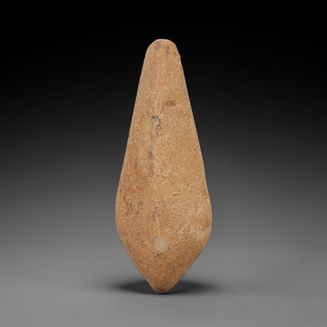 Ancient Egyptian Stone Amulet - Pear-Shaped Pendant, 30AE: Carved from light-toned stone, this ancient Egyptian amulet features a pear-shaped form, a type associated with protective apotropaic use in the Middle Kingdom to early New Kingdom periods. Craftsmans