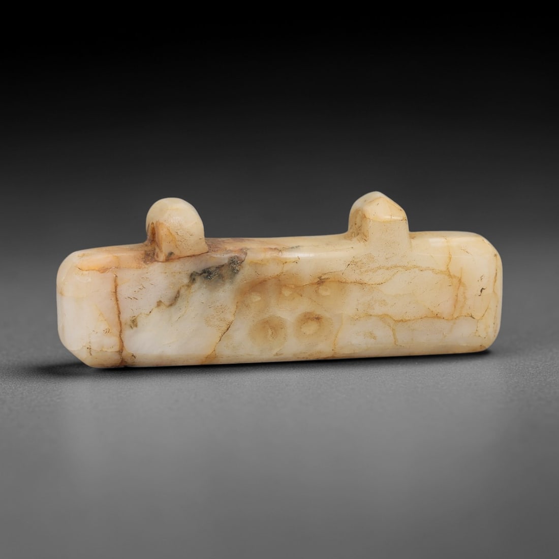 Ancient Marble Amulet - Carved Relief, 1AH: Carved from marble, this ancient amulet features a finely detailed carved relief with a compact, elongated form, characteristic of Near Eastern glyptic art. The carving exhibits fine craftsmanship wit