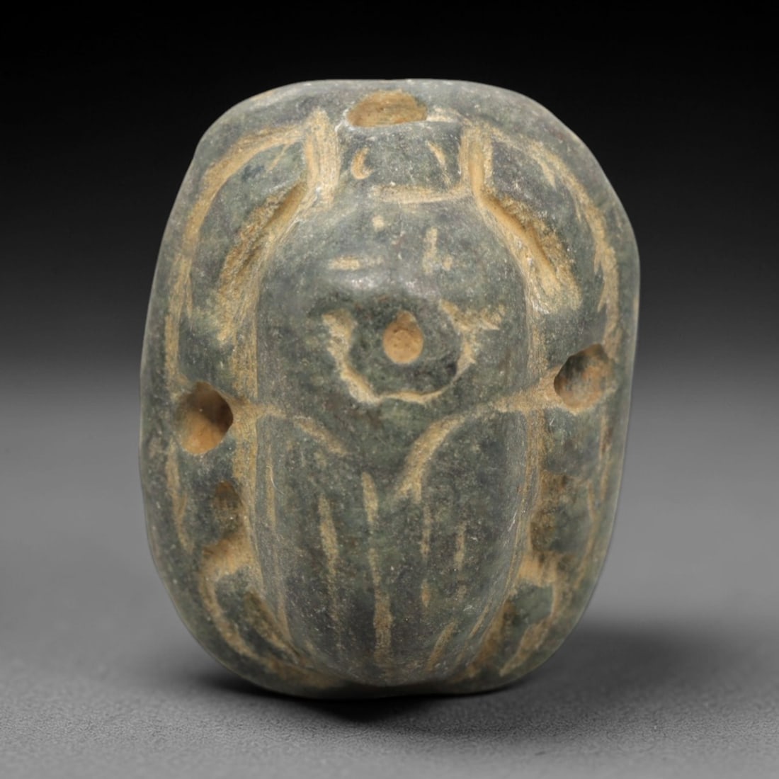 Ancient Egyptian Scarab Seal - Steatite Amulet, 85ZP: This artifact is a carved steatite scarab seal, executed in the iconic protective tradition of ancient Egypt. The dorsal face depicts a detailed scarab beetle with incised elytra, legs, and head, alon