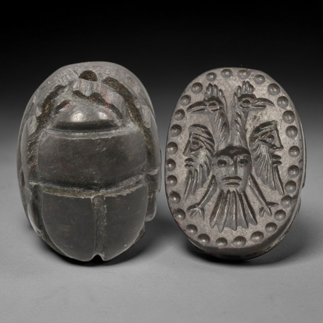 Ancient Hardstone Scarab - Near Eastern Composite Tricephalic Seal, 80AS: This artifact is hand-carved from a dark, fine-grained hardstone, utilizing traditional ancient seal craftsmanship consistent with Near Eastern or Phoenician Iron Age traditions. The object takes the