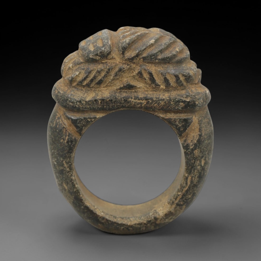 Ancient Steatite Scarab Ring - Achaemenid Signet Ring, 32ZQ: Carved from steatite, this ancient Achaemenid ring features a stylized scarab motif with linear detailing, characteristic of Achaemenid glyptic art. The ring exhibits a smooth, aged patina consistent