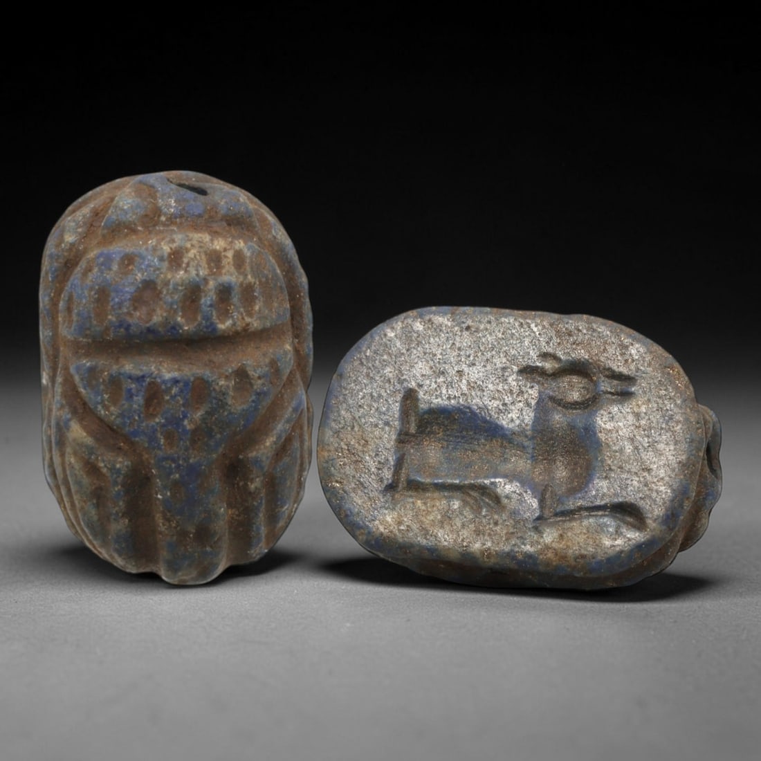 Ancient Lapis Lazuli Scarab - Near Eastern Zoomorphic Seal, 56AS: This artifact is hand-carved from lapis lazuli, employing traditional ancient lapidary techniques consistent with Near Eastern Bronze Age seal craftsmanship. The object takes the form of a scarab beet