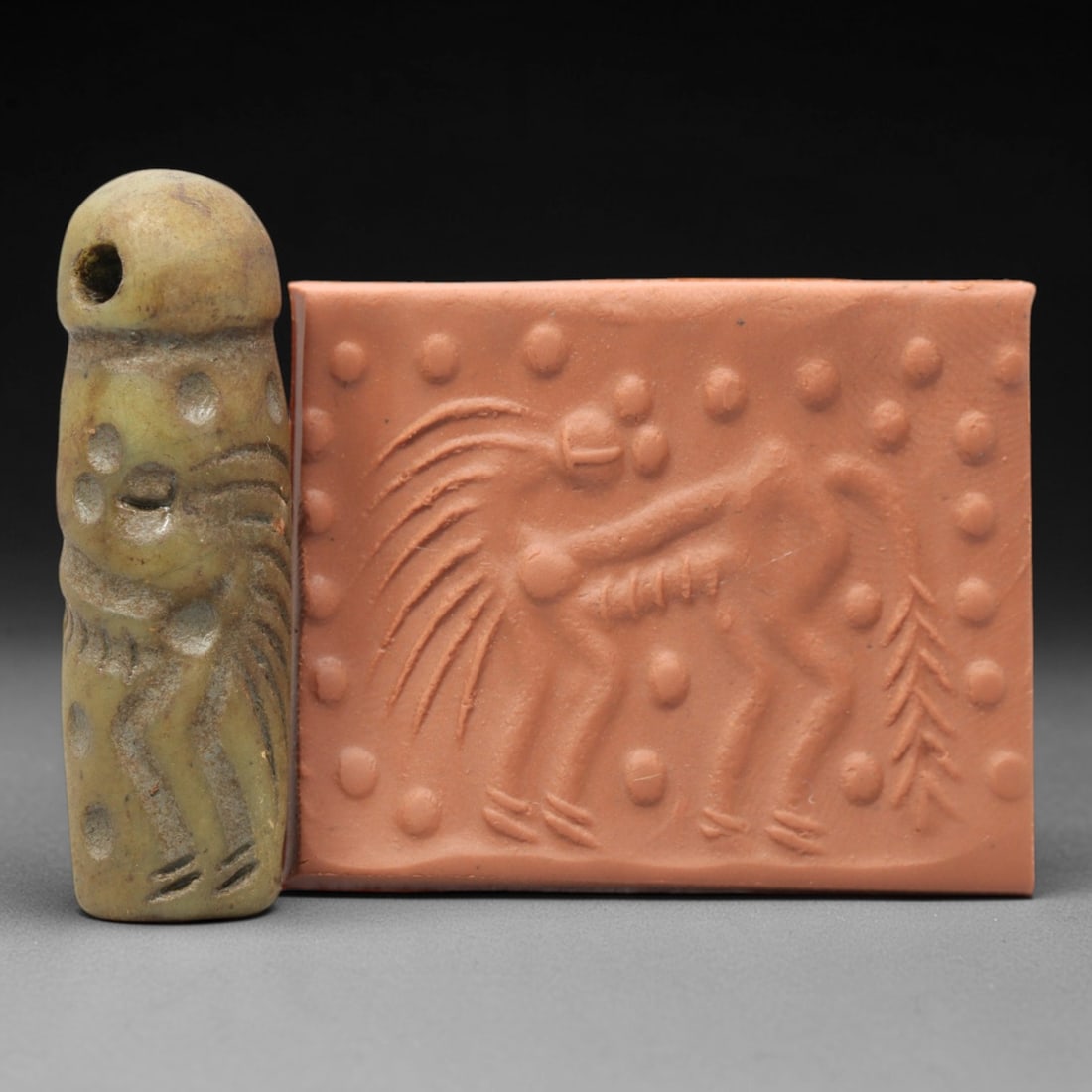 Ancient Serpentine Cylinder Seal - Mesopotamian, 54ZT: Carved from serpentine, this cylinder seal follows the classic cylindrical form of ancient Mesopotamian administrative and ritual artifacts. Attributed to the Bronze Age Mesopotamian cultures, this se