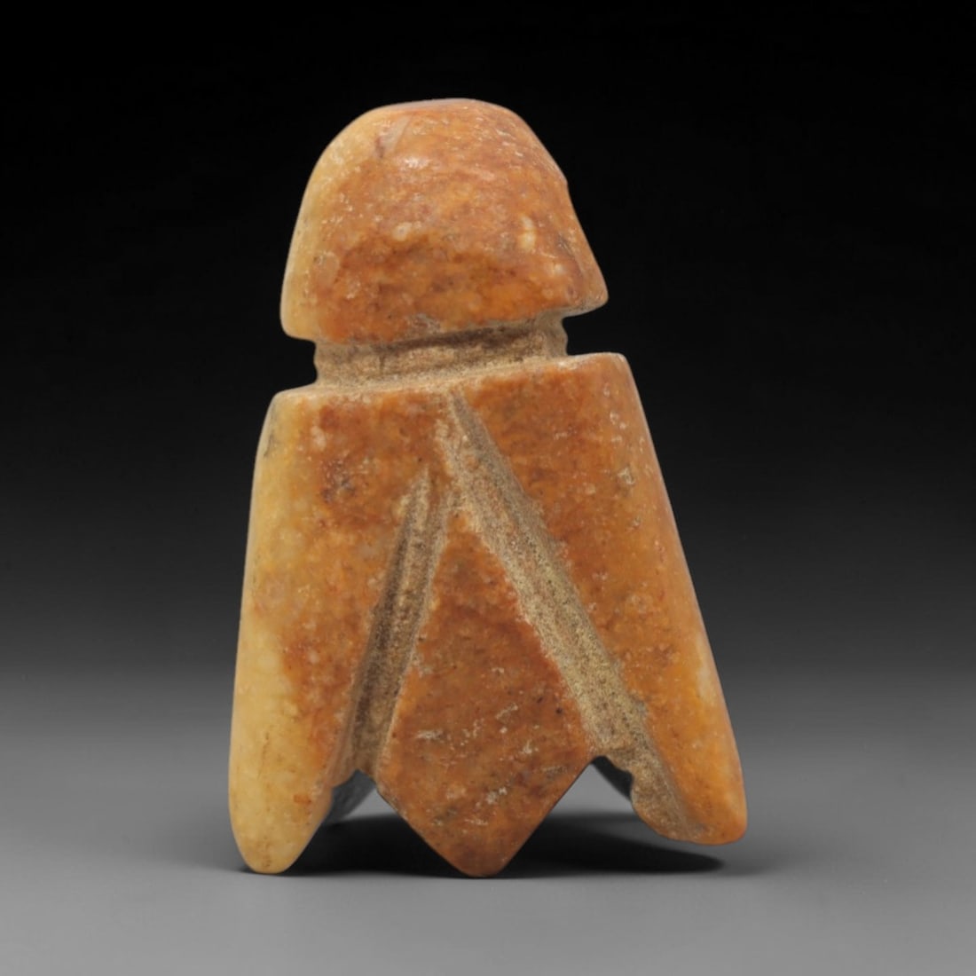 Ancient Calcite Fly Amulet - Egyptian Animal Figure, 62ZW: This amulet is carved from mottled orange-brown calcite, depicting a stylized fly with a rounded head, segmented neck, and angular wing-like body panels incised with diagonal lines. A small perforatio