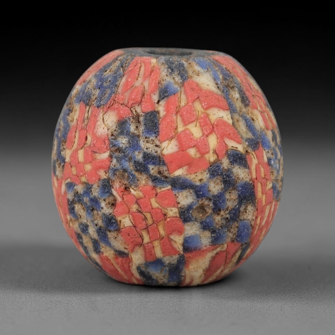 Ancient Glass Mosaic Bead - Roman Amulet Bead, 42ZM: This ancient bead is crafted from polychrome mosaic glass, formed using the tesserae technique characteristic of Roman glassworking traditions. The barrel form features a densely packed pattern of red