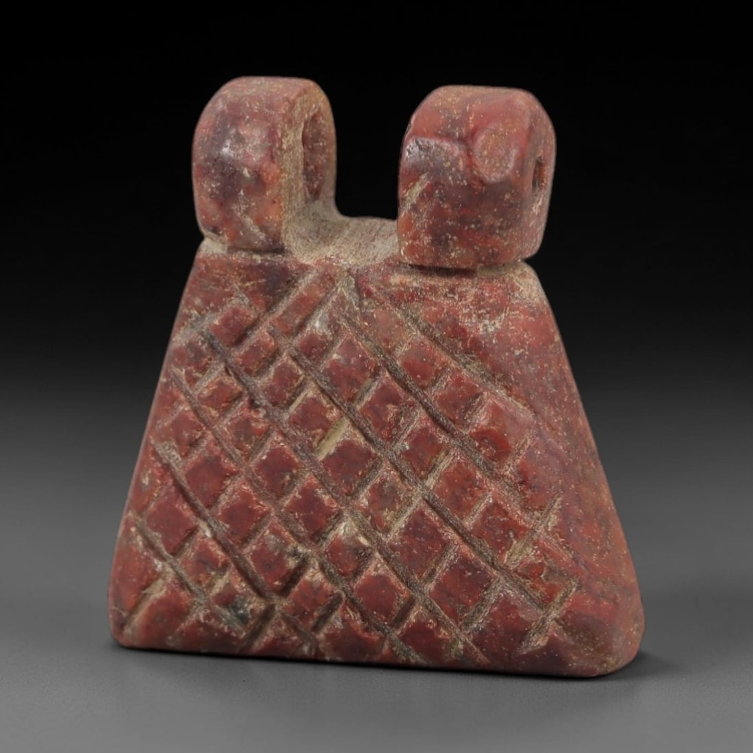 Ancient Egyptian Stone Amulet - Grid Pattern Pendant, 81AE: Carved from reddish-brown stone, this amulet features a bold grid-pattern design on its surface, consistent with ancient Egyptian ritual amulets of the Late Period. The piece has a suspension loop at