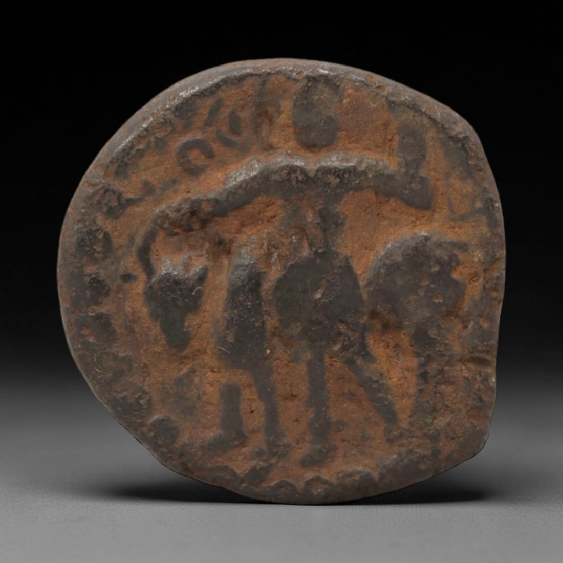 KUSHAN EMPIRE: Royal Devotion - Bronze Coin, 2nd-3rd Century CE, 24x22mm, 7.86g, 3AK: This compact bronze coin from the Kushan Empire showcases the dynasty's iconic fusion of Persian, Greek, and Indian artistic traditions. The obverse features a royal bust in profile with a distinctive