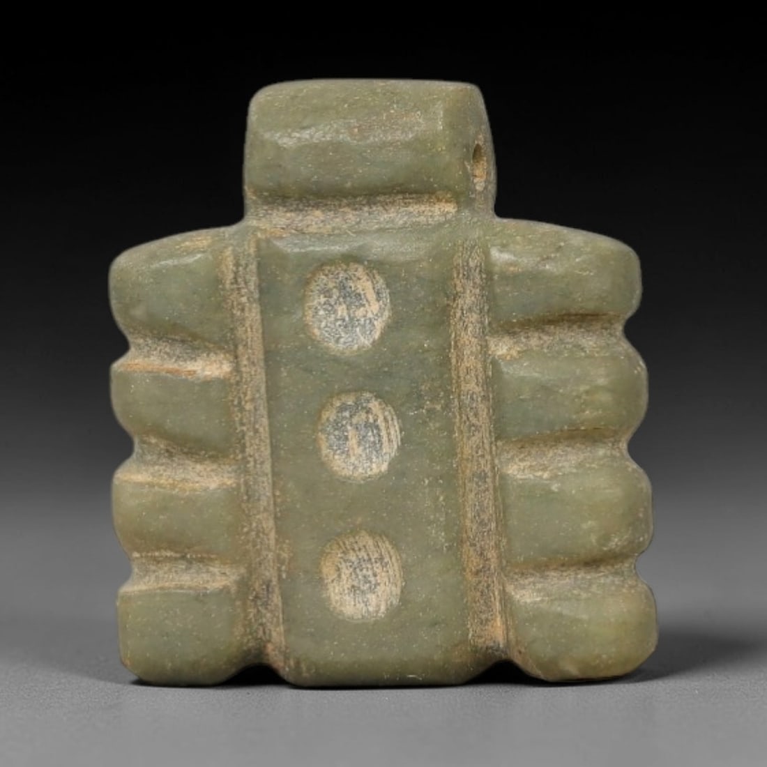Ancient Stone Djed Amulet - Egyptian Ritual Figurine, 74AG: This amulet is carved from a single piece of pale green stone, exhibiting a fine-grained texture with subtle surface wear and faint ochre patina across its surface. The form is a stylized representati