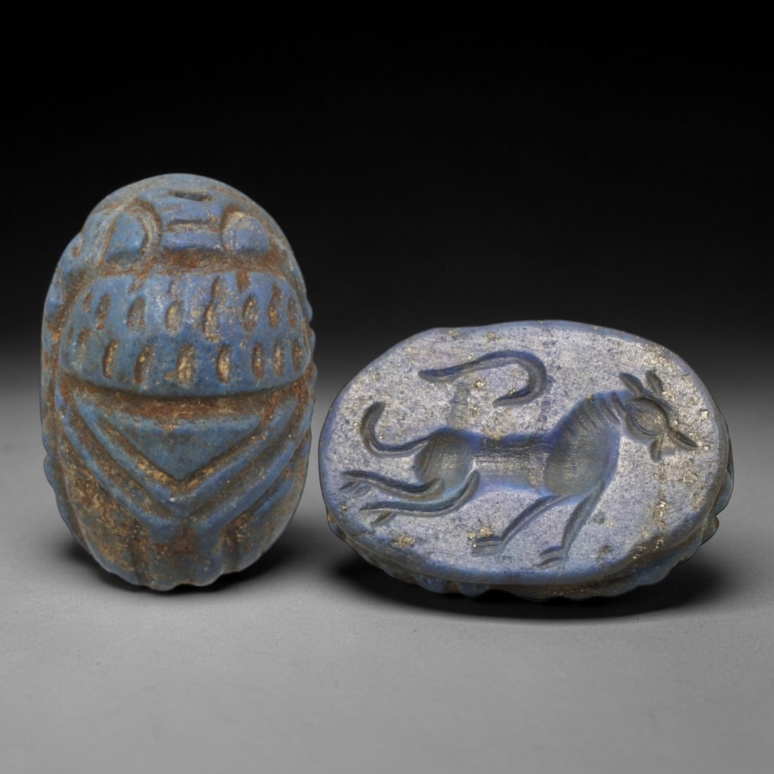 Ancient Lapis Lazuli Scarab - Near Eastern Zoomorphic Seal, 57AS: This artifact is hand-carved from lapis lazuli, employing traditional ancient lapidary techniques consistent with Near Eastern Bronze Age seal craftsmanship. The object takes the form of a scarab beet