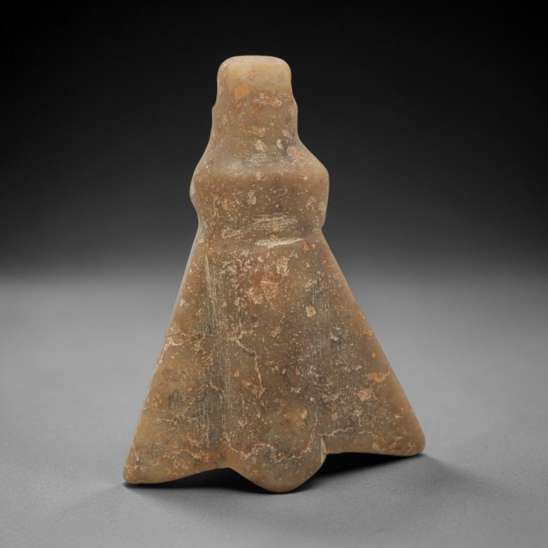 Ancient Egyptian Stone Fly Amulet - Carved Pendant Figure, 91ZW: This amulet is carved from a mottled, greyish-brown steatite or similar soft stone, with subtle incised linear details defining its stylized fly form. The piece features a rounded head with a suspensi