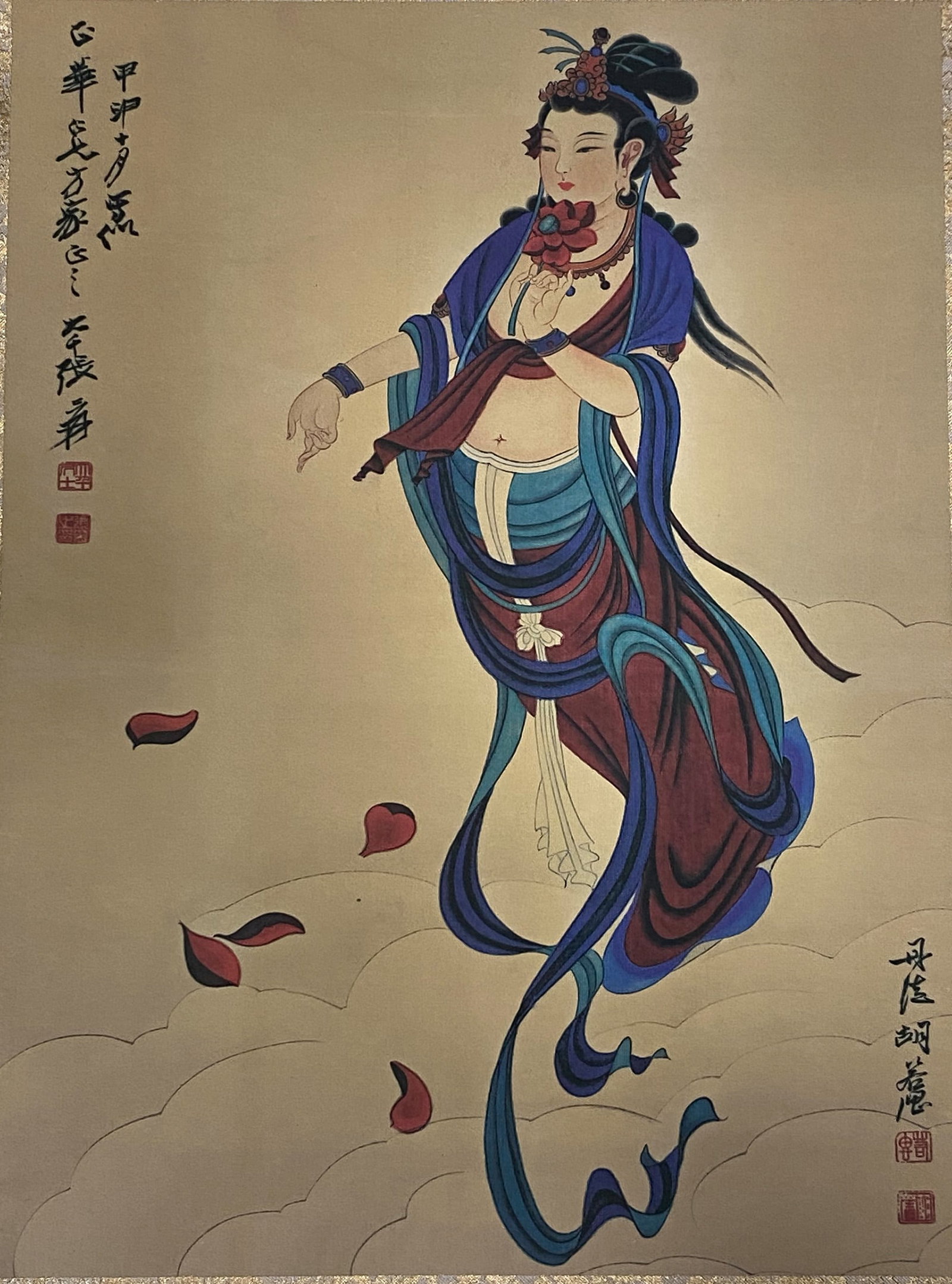 A Chinese Ink and Color Art Print, Bodhisattva on Clouds, 20th Century, 10FV: Printed on a warm, aged silk or paper ground, the composition depicts a bodhisattva figure in a dynamic, floating pose atop stylized clouds. The figure is adorned with an elaborate jeweled headdress,