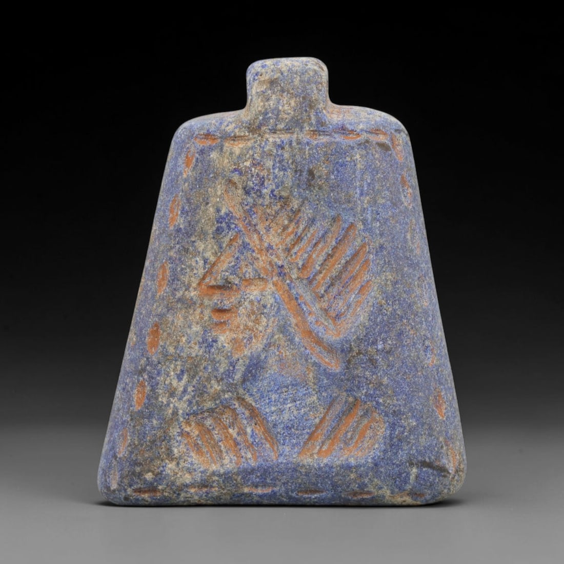 Ancient Lapis Lazuli Amulet - Near Eastern Ritual Pendant, 28ZX: Carved from rich blue lapis lazuli, this ancient amulet features a raised relief depiction of a stylized ritual motif or symbolic icon, rendered in the classic glyptic style of the Near Eastern ancien