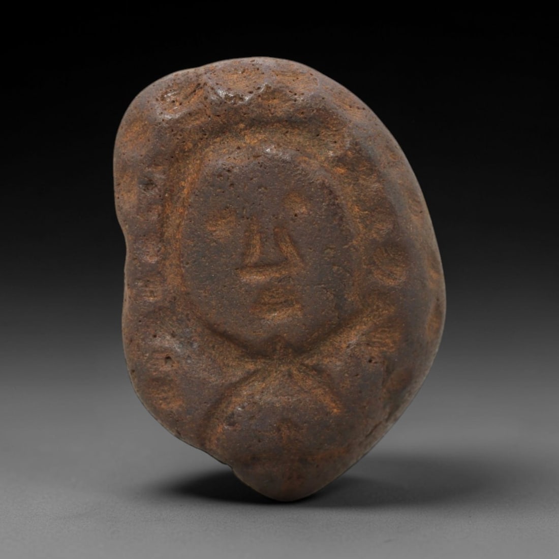 Ancient Bone Anthropomorphic Figurine - Tribal Ritual Artifact, 67FW: Carved from a dense, weathered bone with a porous, earthy-brown patina, this artifact depicts a stylized anthropomorphic figure with a simplified facial schema: incised eye dots, a triangular nasal st