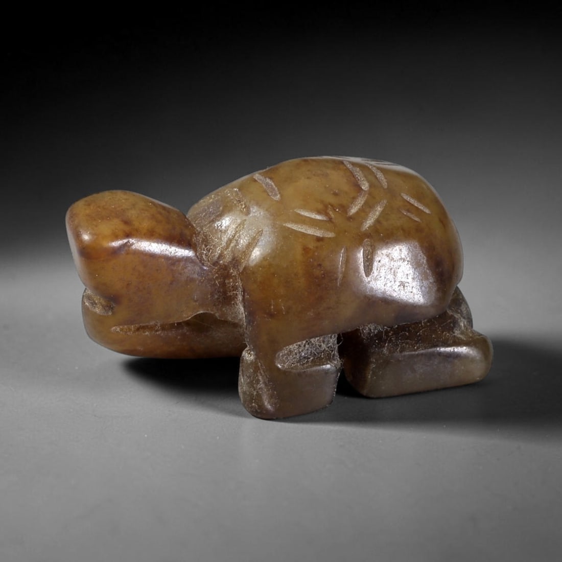 Antique Qing Jade Tortoise Amulet - Chinese Animal Figurine, 46XT: Carved from a warm, honey-brown jade with natural inclusions and a polished surface, this miniature tortoise amulet features incised linear detailing on the shell to define scute patterns, with a comp