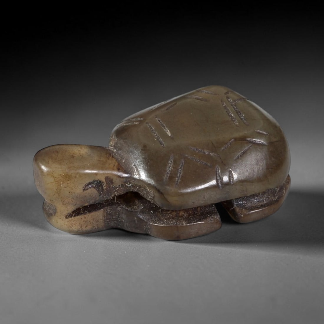 Antique Qing Dynasty Jade Tortoise - Chinese Amulet Figurine, 43XT: Carved from a semi-translucent, dark brown jade with natural inclusions and a polished surface, this miniature tortoise amulet features incised linear detailing on the shell to define scute patterns,